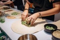 in-store cooking demonstration of vegan burrito making