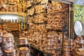 Shelves in a store of copper utensils at the market.