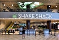 Store front of fast food restaurant Shake Shack at Changi Airport Jewel. Wide angle shot