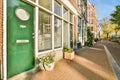 a store front with a green door on a street