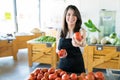 Store Manager Promoting Healthy Vegetables In Shop