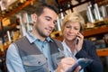 store manager with warehouseman checking goods