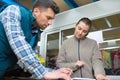 store manager with warehouseman checking stock levels Royalty Free Stock Photo