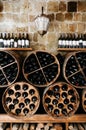 Store of old bottles of wine in cellar. Close up Royalty Free Stock Photo