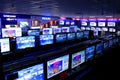 Rows of TVs stand on shelves Royalty Free Stock Photo