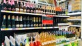 A store shelf with many bottles of wine, including some that are pink Royalty Free Stock Photo