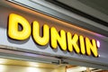 Store sign at the entrance to retail bakery Dunkin Donuts