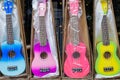 Store window filled with colorful acoustic gitars in Deventer, The Netherlands