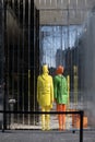 Store window with mannequins dressed in yellow and green wardrobe - fresh colors for spring