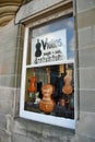 Store window of violin shop in Falkland, Fife, Scotland