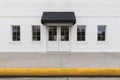 Storefront building with black awning Royalty Free Stock Photo