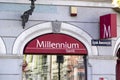 Storefront of Millennium Bank providing financial services with a banner in Torun, Poland