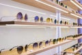 Storefront shelves of various modern sunglasses at the airport`s retail store Royalty Free Stock Photo