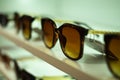 Storefront shelves of various modern sunglasses in retail store. Display rack full of sunglasses. Stand with sunglasses Royalty Free Stock Photo