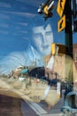 Storefront singer, guitar player serenades urban street scene Royalty Free Stock Photo