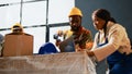 Storehouse employees packing containers in depot