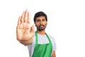 Storekeeper holding palm as stop gesture
