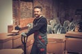 Storekeeper working with pallet truck in a warehouse Royalty Free Stock Photo