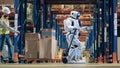 Storeman controls robot transporting load