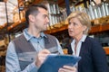 storeman talking to manager in warehouse Royalty Free Stock Photo