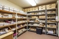 storeroom, with bins and shelves organized by type of document