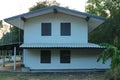 2 storey wooden house, Asian style, white color, beautiful design, vintage style. Royalty Free Stock Photo