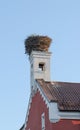Stork`s nest on the roof of the house Royalty Free Stock Photo