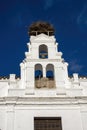 Storks nest located on the bell tower of the Puerta de Jerez, Gateway of Jerez in Zafra, Badajoz, Spain Royalty Free Stock Photo