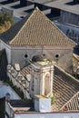 Storks nest in a tower surrounded by roofs in Sanlucar de Barrameda, Spain