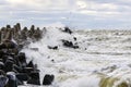 Storm on the Baltic coast, waves hitting the breakwater concrete tetrapods Royalty Free Stock Photo