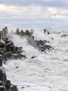 Storm on the Baltic coast, waves hitting the breakwater concrete tetrapods Royalty Free Stock Photo