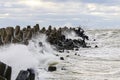 Storm on the Baltic coast, waves hitting the breakwater concrete tetrapods Royalty Free Stock Photo