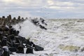 Storm on the Baltic coast, waves hitting the breakwater concrete tetrapods Royalty Free Stock Photo