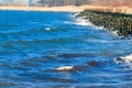 Storm in the Baltic sea. Storm waves crashing on the breakwater in Darlowo, Poland Royalty Free Stock Photo