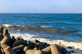 Storm in the Baltic sea. Storm waves crashing on the breakwater in Darlowo, Poland Royalty Free Stock Photo