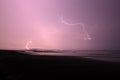 Electric storm in the beach, sand clouds and thunders. Royalty Free Stock Photo