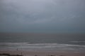 Storm on the beach. The seas are raging and the skies show the tropical storm as the power of nature is demonstrated. palm tree pu