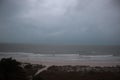 Storm on the beach. The seas are raging and the skies show the tropical storm as the power of nature is demonstrated. palm tree pu