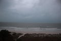 Storm on the beach. The seas are raging and the skies show the tropical storm as the power of nature is demonstrated. palm tree pu