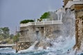Storm on beautiful croatian beach with waves crushing on cliffs.