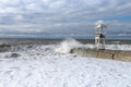 Storm in the Black Sea and an observation tower in the Adler resort, Russia