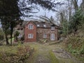 Storm blew down tree crashed in to roof of house Royalty Free Stock Photo