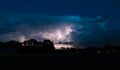 Storm cloud is illuminated by lightning flashes Royalty Free Stock Photo