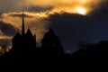 Storm cloud illuminated by the sun setting behind the cathedral of Geneva, Switzerland.