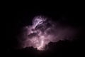 Lightning Illuminating Storm Clouds at Night Royalty Free Stock Photo