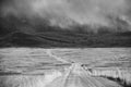 Storm Cloud Passing Through a Barren Mountain Land Royalty Free Stock Photo