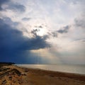 Storm cloud and rain over coastline