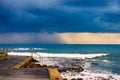 Storm cloud with rain over stormy sea. Royalty Free Stock Photo