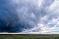 Storm clouds above field of green grass Royalty Free Stock Photo