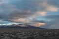 Storm clouds above mountains with cars Royalty Free Stock Photo